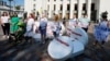 Patients and activists take part in a performance demanding the decriminalisation of medical cannabis, in Kyiv