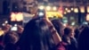 Supporters recording at concert - Candid image of crowd at rock concert