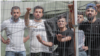 Lithuania - migrants (mostly) from Iraq who were detained after crossing the border from Belarus - Current Time video - screen grab